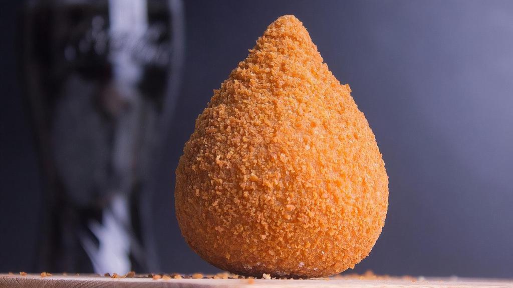 Coxinha · A traditional brazilian appetizer made with wheat dough filled with shredded chicken and deep-fried.