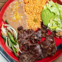 Arrachera · Grilled skirt steak served with rice, beans, grilled onions and tortillas.