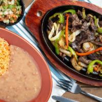 Fajitas Del Señor · Beef, chicken, shrimp with seared onions and bell peppers.