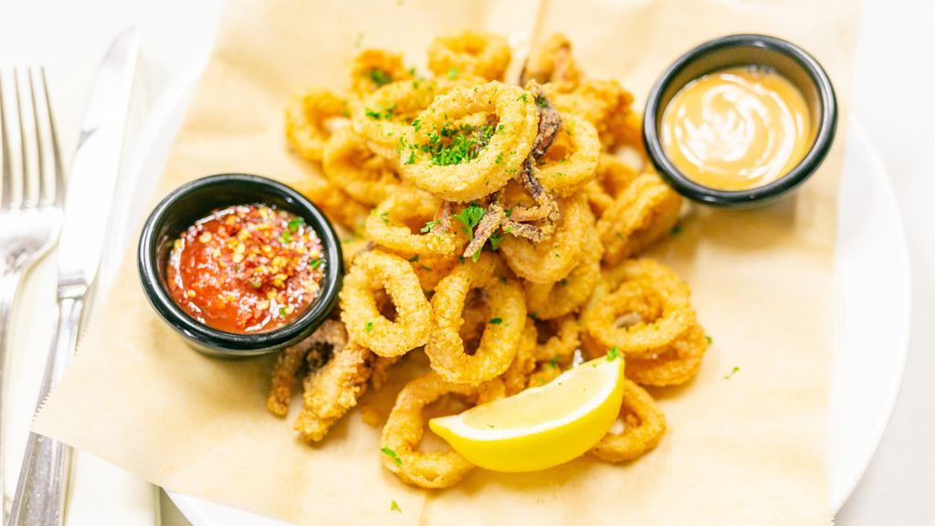 Sip Fried Calamari · Lightly battered golden calamari with house marinara sauce.