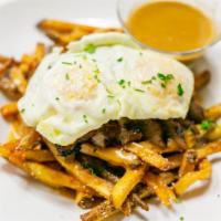Steak Poutine · Grilled to perfection tender steak over a mountain of our hand-cut fries all topped with our...