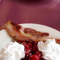 French Toast · Served with 2 bacon strips or links.