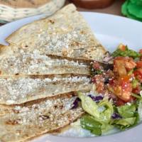 Quesadillas · Made with local flour tortillas and Mexican cheese blend.