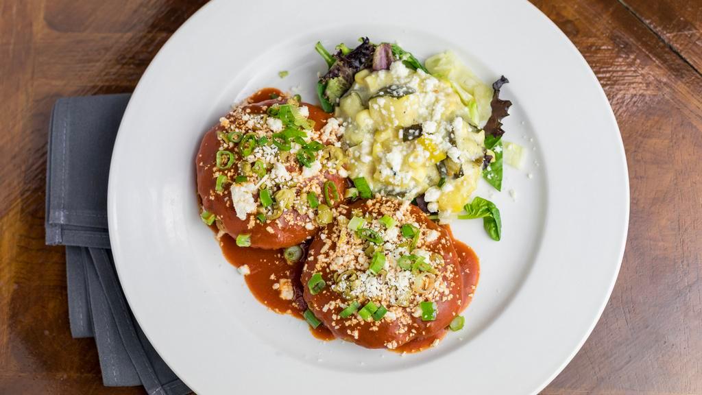 Tucson'S Enchiladas Sonorenses · Gluten free, vegetarian. A Tucson tradition of native ground corn masa cakes, red chile sauce, green olive, cebolla and queso.