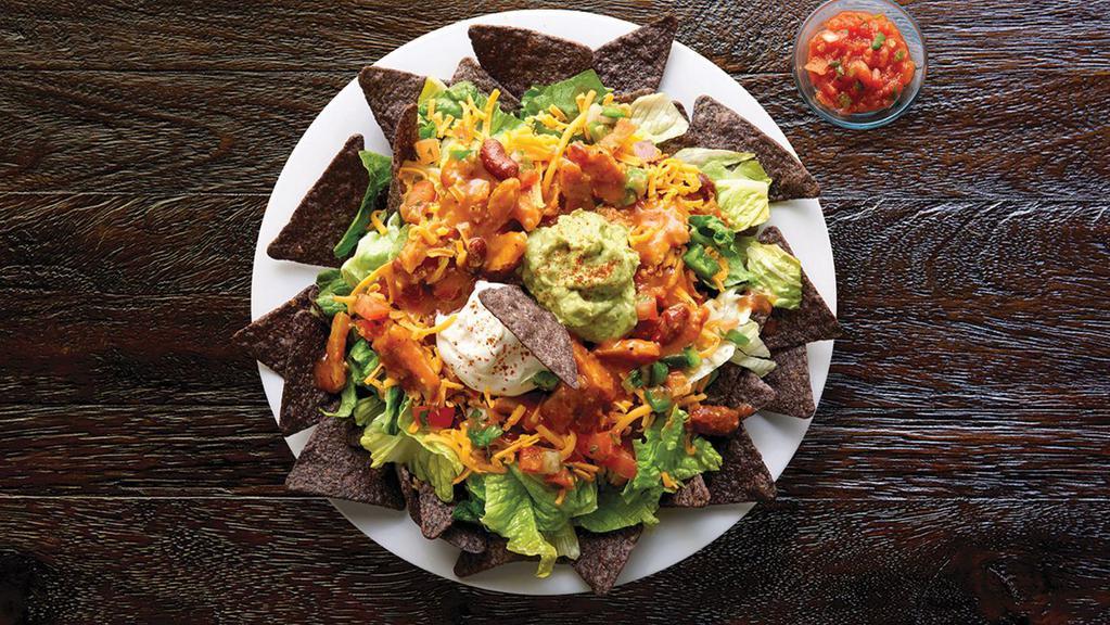 Taco Salad · Shredded lettuce, blue corn chips, cheddar, sour cream, guacamole, pico de gallo, southwest spices, side of salsa, with chili, southwest chicken chili, or black bean & corn mix.