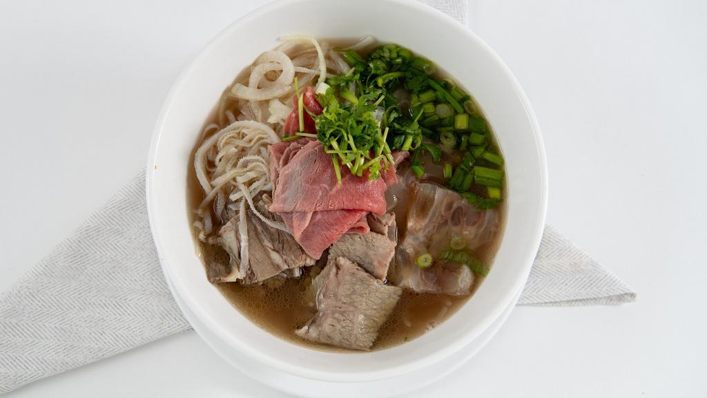 Combination Pho (Đặc Biệt) · House special pho that comes with steak, brisket, fatty flank,  and tripe.