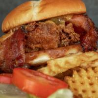 Bacon Cheddar Fried Chicken Sandwich · Thick Cut Pepper Bacon and Tillamook Cheddar Cheese. with a side of chipotle aioli