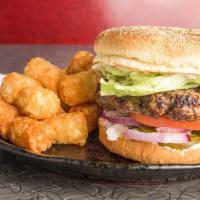 Zip Burger · Bun is dressed with zippy’s secret sauce, lettuce, tomato, red onion, and pickles. All burge...