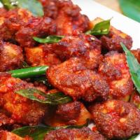 Chicken 65 · Battered and fried boneless chicken cubes bathed in our own blend of spices and onion masala.
