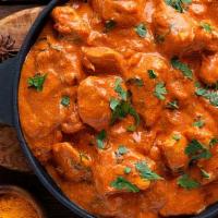 Butter Chicken · Yogurt based marinated chicken cubes cooked in rich onion, tomato & cashew sauce topped with...