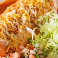 Rivas Wet Burrito · Steak, Pastor, Beans And Cheese In Side, Lettuce and Mexican Salsa On The Side.