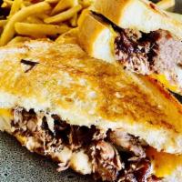 Short Rib Grilled Cheese · BRAISED SHORT RIB, AMERICAN, SWISS AND CHEDDAR CHEESE, SERVED ON A GARLIC SOUR DOUGH TOAST