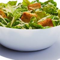 Side Caesar Salad · Romaine lettuce with shredded parmesan cheese, home-style croutons, and creamy Caesar dressi...