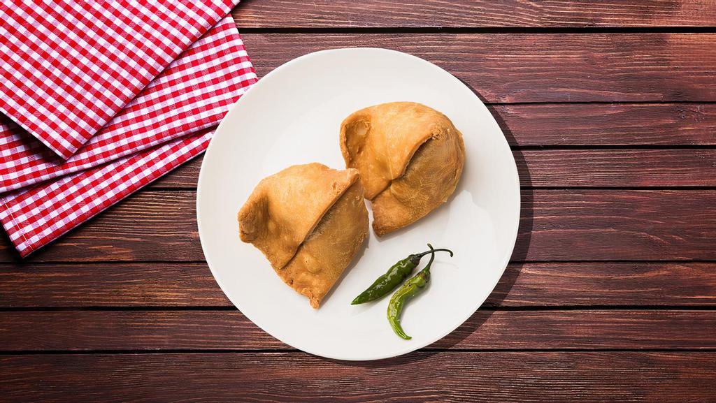 Samosa Junction · Triangle-shaped deep-fried pastry dumplings filled with spiced potatoes and vegetables.