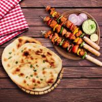 Chicken Tikka & Naan Bread  · Combining the all-time favorite chicken tikka with herby mint chutney and healthy veggies, a...