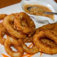 Crispy Calamari Rings · Calamari deep-fried golden brown and served with our homemade plum sauce and ground peanuts.