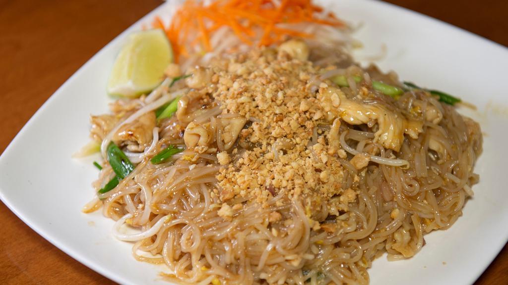 Pad Thai · Thai rice noodles stir-fried with egg, bean sprout, red onion, green onion in our tamarind sauce served with ground peanuts.