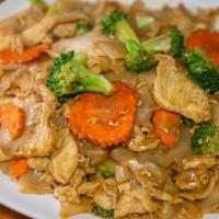 Pad See Ew · Wide rice noodles stir-fried with egg, broccoli, and carrots in sweet soy sauce.
