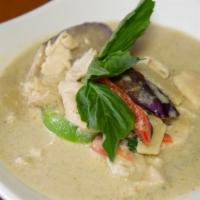Green Curry · Green curry paste with coconut milk, eggplant, bamboo shoot, bell pepper, and basil leaves.