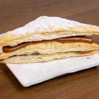 Mil Hojas · Puff pastry layers filled with caramel spread and topped off with powdered sugar.