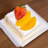 Tres Leches Slice Cake · With fruit on top.
