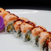 King Roll · Shrimp tempura, avocado, topped with seared salmon, spicy sauce, unagi sauce.