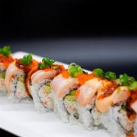 Paradise Roll · Crab salad, avocado, cucumber, topped with baked salmon, eel sauce, spicy sauce, masago, gre...