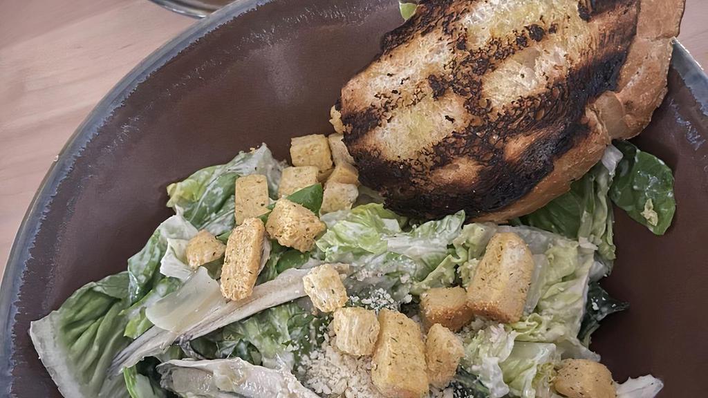 Caesar Salad · Baby gem lettuce, house made parmesan crisp, grilled sourdough, Caesar dressing, anchovy.