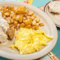 Country Breakfast · Chicken fried steak 1/2 order of biscuits and gravy country potatoes and two eggs.
