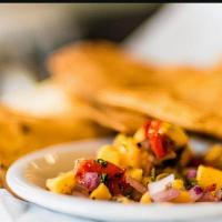 Guacamole Chips Salsa & Poblano · Herbed flour tortilla chips fried to crunchy deliciousness. Served with  our sweet n’ slight...