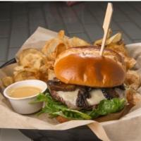 Mushroom Spinach Swiss Burger · Seasoned and cooked to perfection, our Aspen Ridge burger topped with melted Swiss cheese, g...