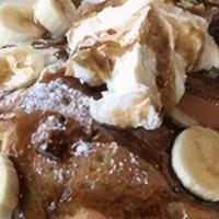 Full Banana Pancakes · Six of our Buttermilk Pancakes filled with bananas. Served with a side of whip cream and coc...
