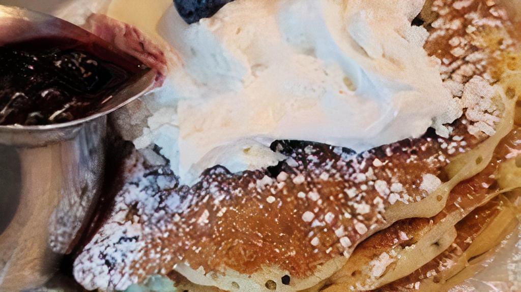 Full Blueberry Pancakes · Six of our buttermilk pancakes filled with fresh plump blueberries. Served with a side of Whip Cream and Blueberry Compote. 890 Cal.