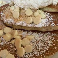 Full Macadamia Pancakes · Six of our buttermilk pancakes filled with white chocolate chips. Topped with more chips and...