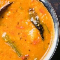Sambar (Lentil) Soup · Orange lentils (Toor Dal) simmered with vegetables, onions, tomatoes, and home spices with a...