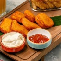Chicken Nuggets With Fries · tender chicken nuggets and thick cut french fries served with ketchup and creamy butter sauce.
