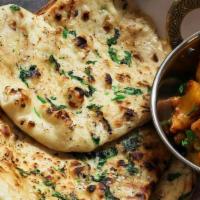 Garlic Naan · naan bread cooked with garlic and cilatro toppings