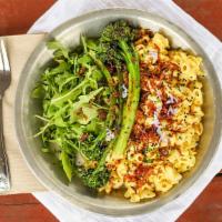 Not Yo Mama'S Mac · Heaping serving of quinoa elbows, creamy cashew sauce, broccolini, arugula, topped with frie...