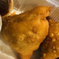 Samosa Chaat · Treat from the street of India, medley of samosa with sweet and tangy chickpeas true delicacy.