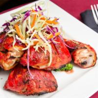 Tandoori Chicken · Gluten-free. Chicken thigh marinated with spices and chargrilled to perfection.