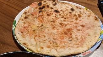 Garlic Naan · House favorite. Naan with a slight touch of garlic.