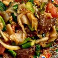 Kee Mao Noodle · noodle stir fry with fresh garlic, fresh Thai pepper, Holy basil, onion, bell peppers , Medi...