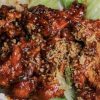 Crispy Garlic Chicken · Deep fried marinated chicken with shrimp paste house sauce serve on top of lettuce serve wit...