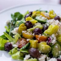 Feta Salad · Fresh romaine lettuce, cucumbers, tomatoes, parsley, sumac, feta cheese, black olives.