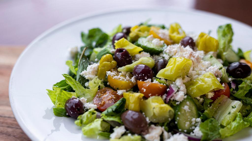 Feta Salad · Fresh romaine lettuce, cucumbers, tomatoes, parsley, sumac, feta cheese, black olives.