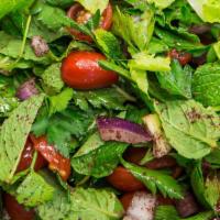 Fattoush Salad · Fresh romaine, pomegranate, cucumbers, radishes, peppers, onions, mint, parsley with sumac, ...