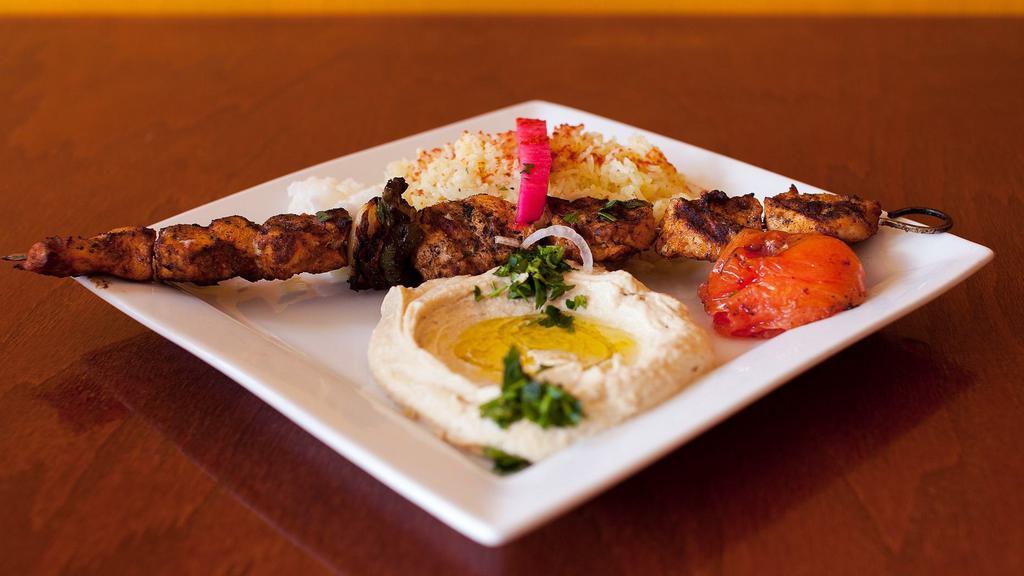 Kebab Platter · Your choice of: chicken breast kabob or grassfed beef kafta kabob, served with a house salad, basmati rice, hummus and garlic sauce.