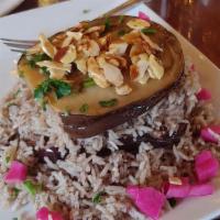 Lebanese Rice · Seasoned grass-fed beef cooked with jasmine rice and topped with toasted almonds and raisins.