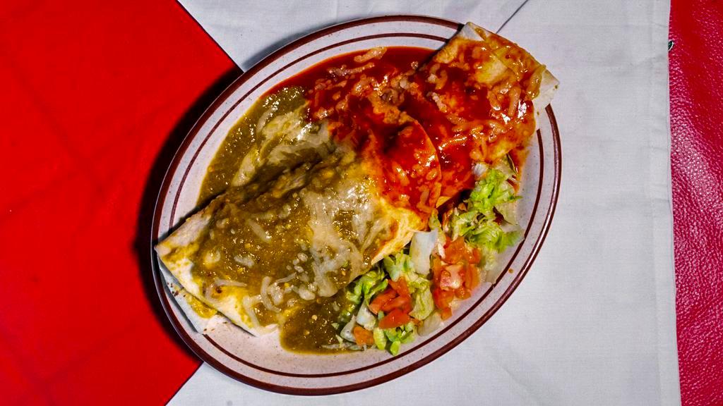 Super Burrito Lunch Special · Filled with rice, beans, lettuce, tomatoes, cheese, sour cream, guacamole and your choice of beef, chicken, pork or veggie. Red chile, green chile or Christmas.