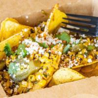 Mexican Street Corn Nacho~ · Crispy corn chips, shredded cheese, Mexican street corn, Jalapenos and cilantro.